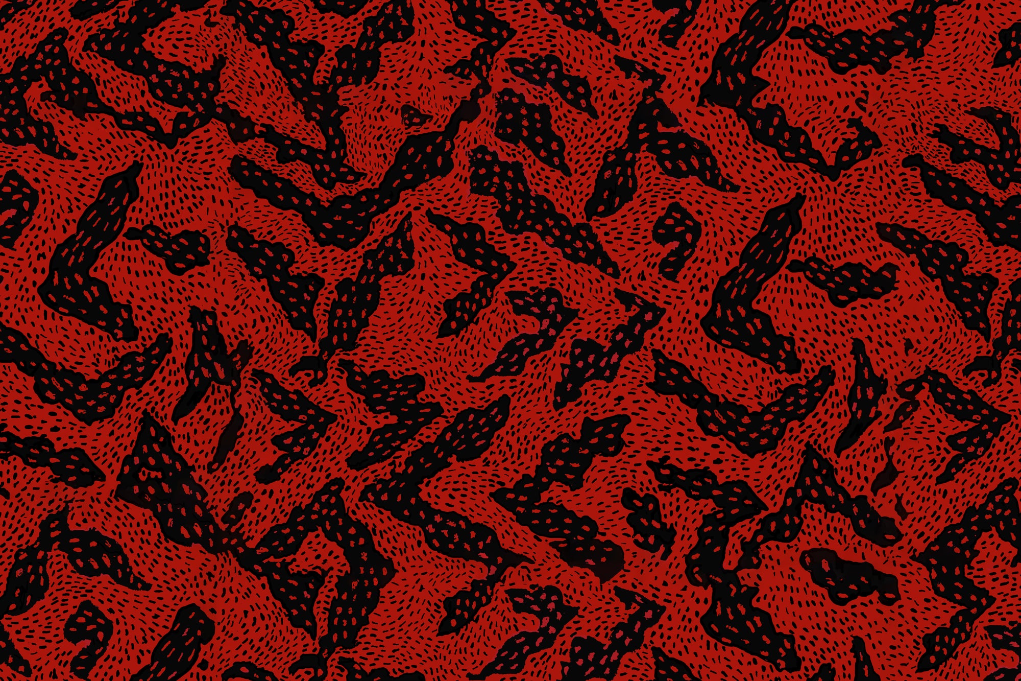 A close-up of a red and black abstract pattern with organic, brushstroke-like shapes and fine dotted texture.