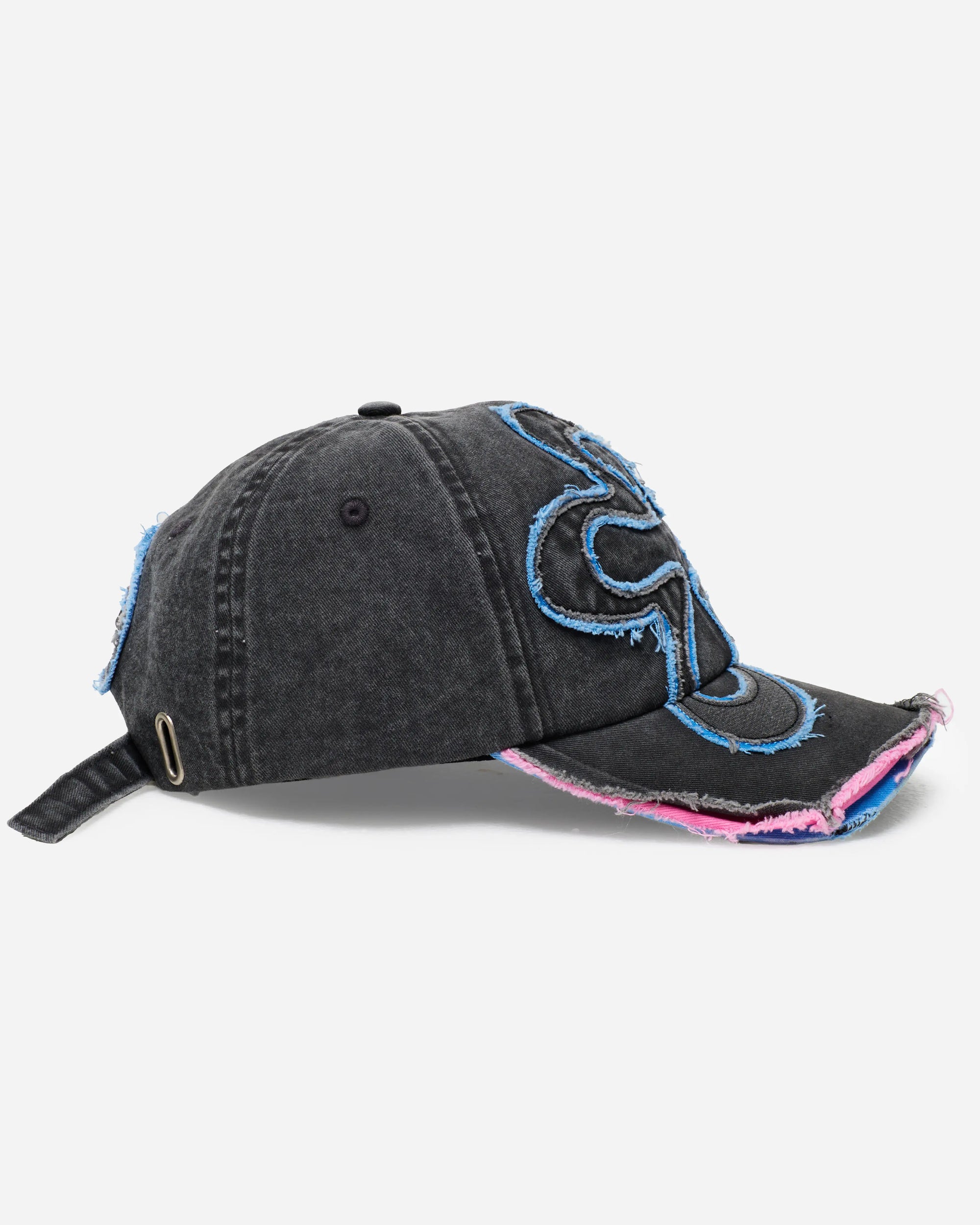 Black denim cap with blue and pink accents on a white background