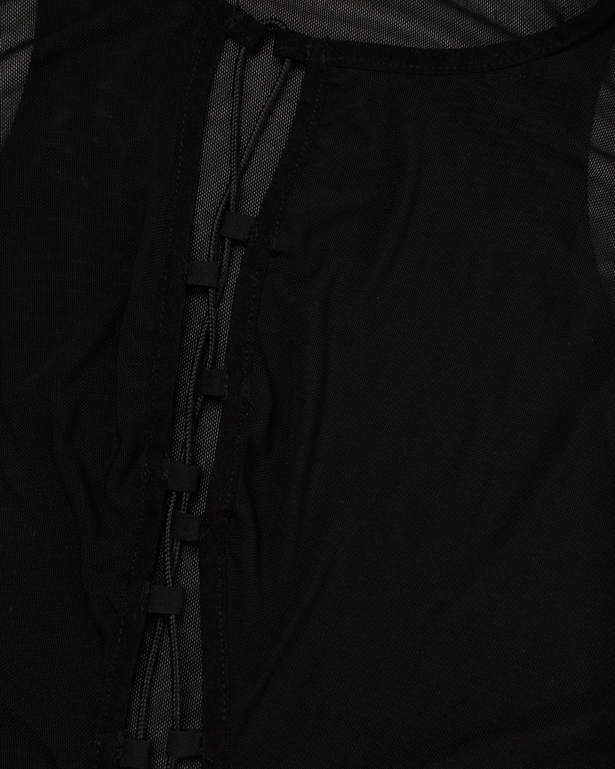 Close-up of a black mesh sleeveless top.