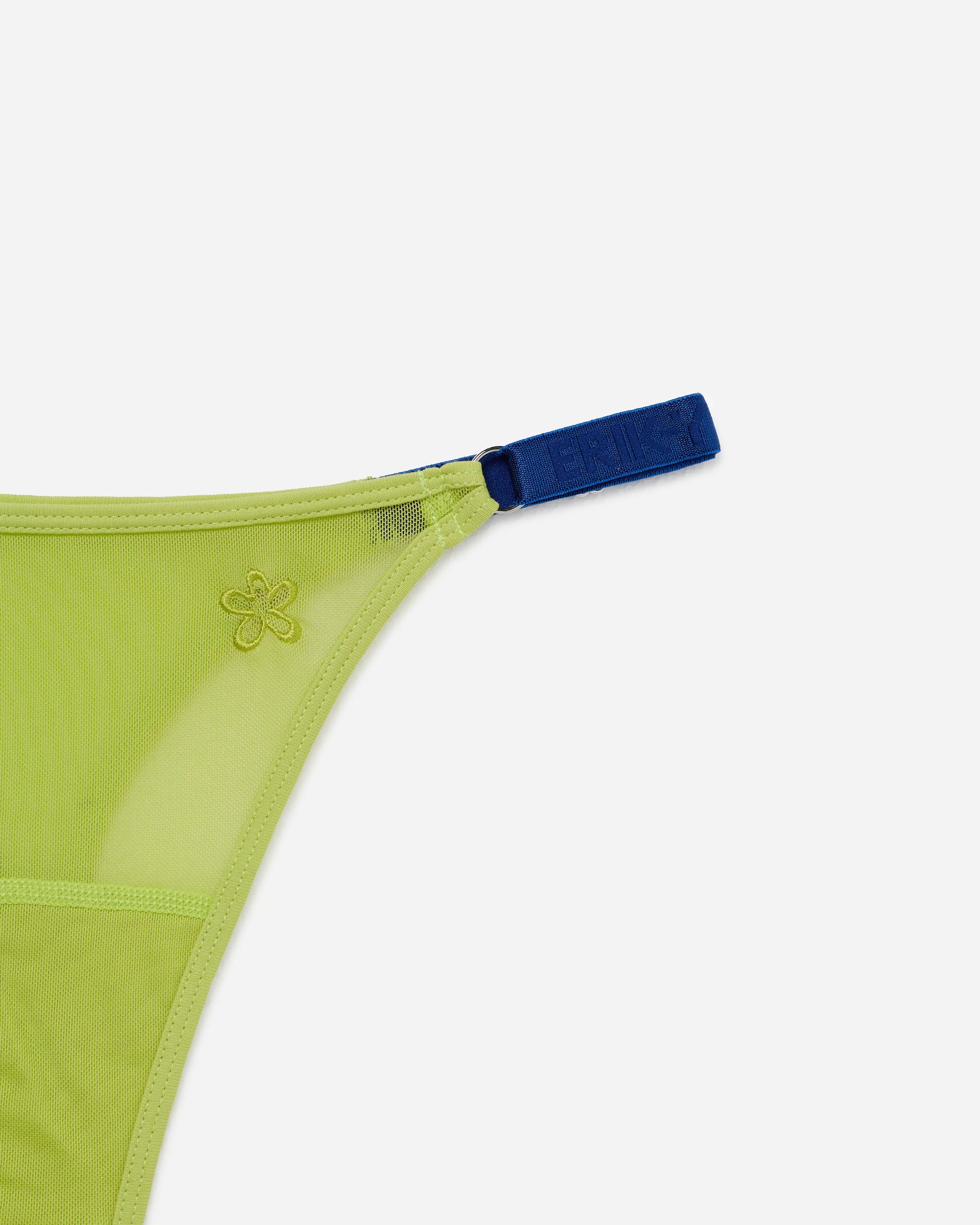 Close-up of a bright lime green mesh thong with a contrasting dark blue waistband strap, featuring a small embroidered flower logo.