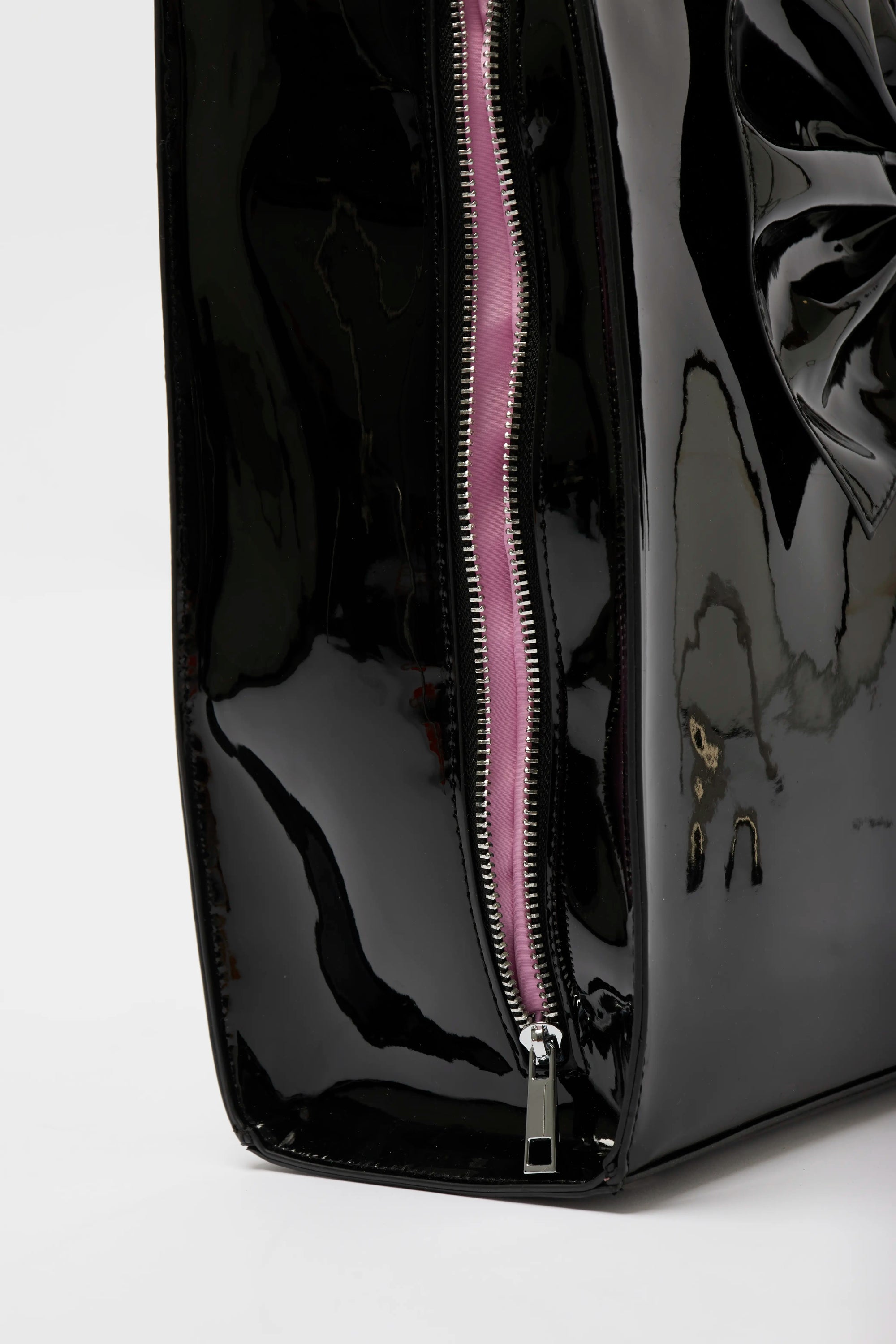 Close up detail of the Oversized Patent Tote laptop compartment. 
