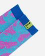 A close-up of a pair of patterned socks with a bright blue cuff and a lime green tag that reads 'ERIK <3 U' with a small heart. The sock body features a repeating pattern of pink and turquoise shapes on a light blue base.